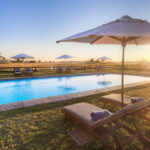 Sun loungers surround the swimming pool at Eagle Island Lodge