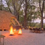 Traditional Sandibe boma dinners around a central fire are popular