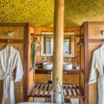 Ensuites bathrooms at &Beyond's Xaranna Okavango Delta Camp spoil guests with indoor bathtubs and al fresco showers
