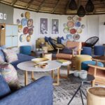 The stylish blue toned lounge area at Baines' Camp