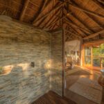 Spacious bathrooms at Camp Moremi have twin basins and showers