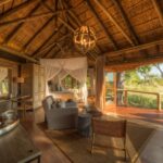 Moremi Camp's guest rooms blend in with the natural environment