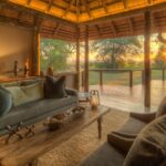 Relax in the spacious lounge at Camp Moremi