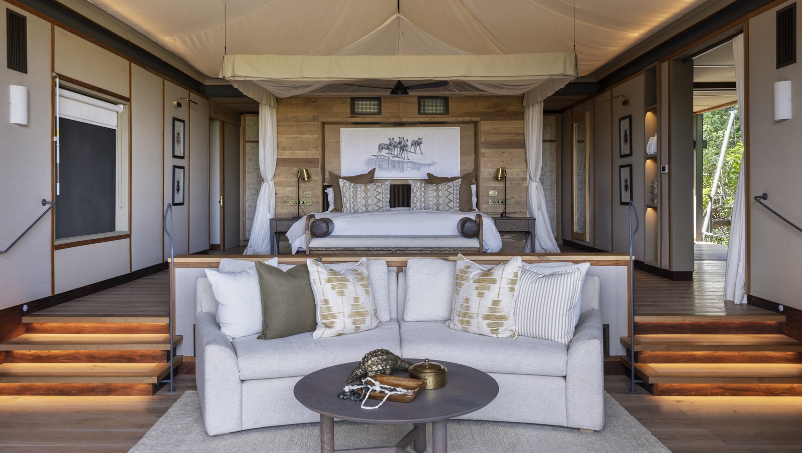 Elegant tented suite at Chitabe with canopy bed and earthy decor