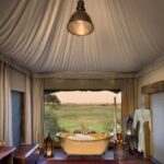 Luxurious bathtubs and carpets in Duba Plains guest tent