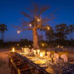 Bush dinner set up by lantern light at Kwetsani camp