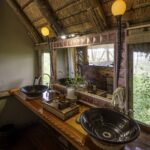 Twin basins in ensuite bathroom at Kwetsani luxury camp