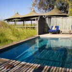 Little Vumbura's swimming pool deck area with shaded sunloungers is a big drawcard at Little Vumbura