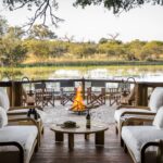 The attractive fire pit setting on deck at Sanctuary Chief's Camp