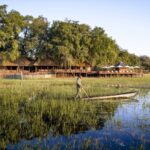 Images of Mokoro in front of Sanctuary Chief's Camp