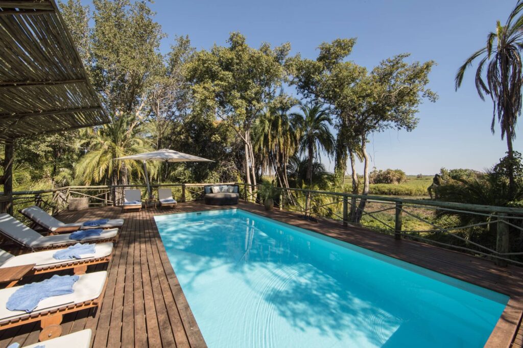 The shaded pool and swimming pool deck area at Setari Camp
