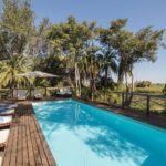 The luxurious shaded swimming pool and deck at Setari Camp