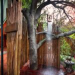 Guest tent outdoor shower at Jack's Camp