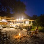 Night time portrait of the fire pit at Little Sable Camp