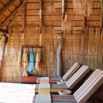 Sun loungers under thatch at Mapula lodge