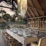 Open air dining room prepared for dinner at Sable Alley