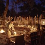 Dinner by lantern light in a traditional African boma at Savute Elephant Lodge