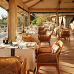 Savute Elephant Lodge dining area with waterhole view