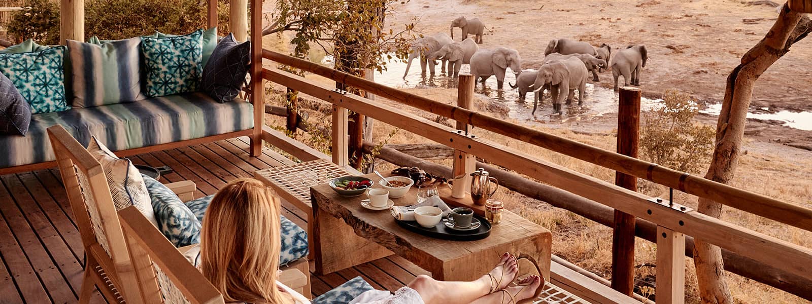 Savute Elephant Lodge guest surveying the landscape from the deck