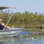 A boating safari from Camp Okavango is a great adventure