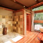 Camp Okavango guest suite bathrooms have double vanities and showers
