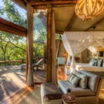 Interior bedroom and lounge space of Camp Okavango guest ten