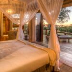Delta view and private deck seen from inside Camp Okavango tent