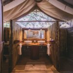 Twin basins in en suite bathroom at Camp Xakanaxa