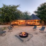 Camp Fire and lodge scene at Dinaka