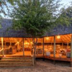 Focus on the main deck area at Dinaka as evening approaches
