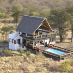 Aerial view of the Lodge and central swimming pool at Feline Fields