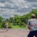 A game of tennis at Feline Fields Kalahari Lodge