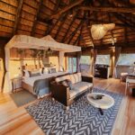 Interior of a luxury tented suite at Kanana Camp in the Okavango Delta, featuring elegant furnishings and expansive views of the surrounding delta landscape