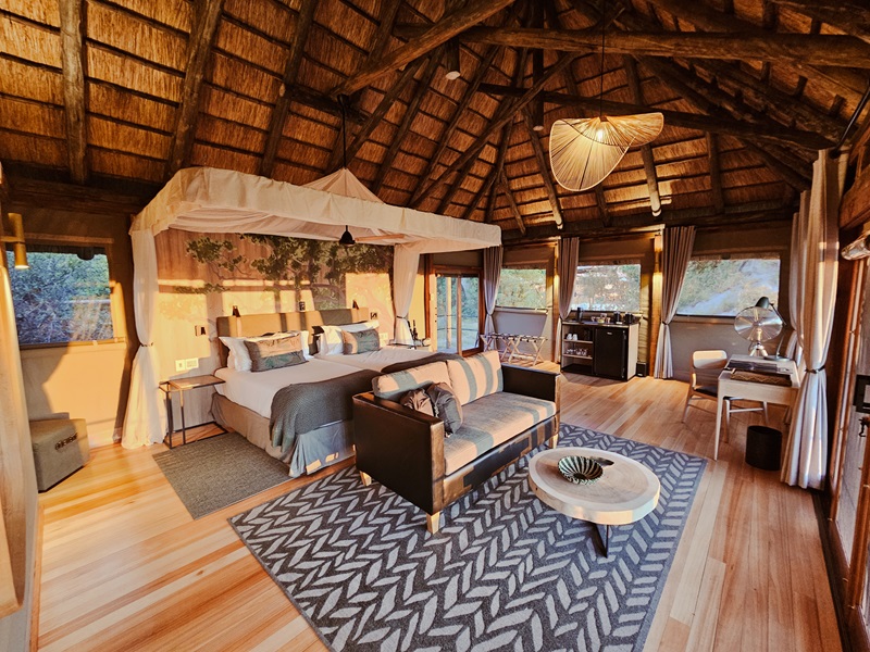 Interior of a luxury tented suite at Kanana Camp in the Okavango Delta, featuring elegant furnishings and expansive views of the surrounding delta landscape