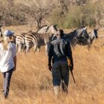 Guests enjoy a guided walking safari at Duma Tau