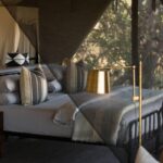 Elegant guest tent interior at the exclusive Little Machaba Camp
