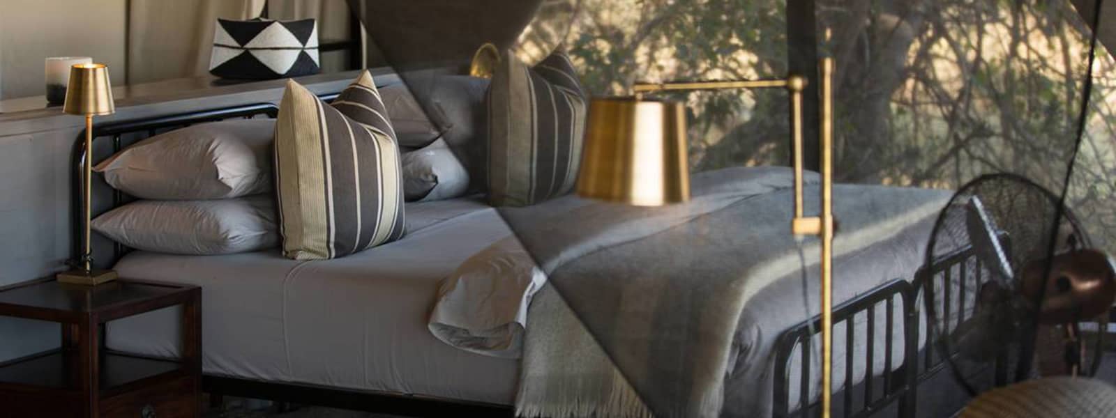 Elegant guest tent interior at the exclusive Little Machaba Camp