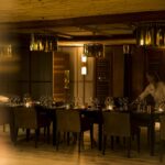 Professional dinner preparations in Little Mombo's dining room