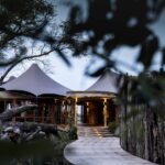 Welcoming entrance to the exclusive Mombo Camp