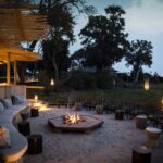 Mombo's central fire pit hosts guests for sundowners and after dinner drinks