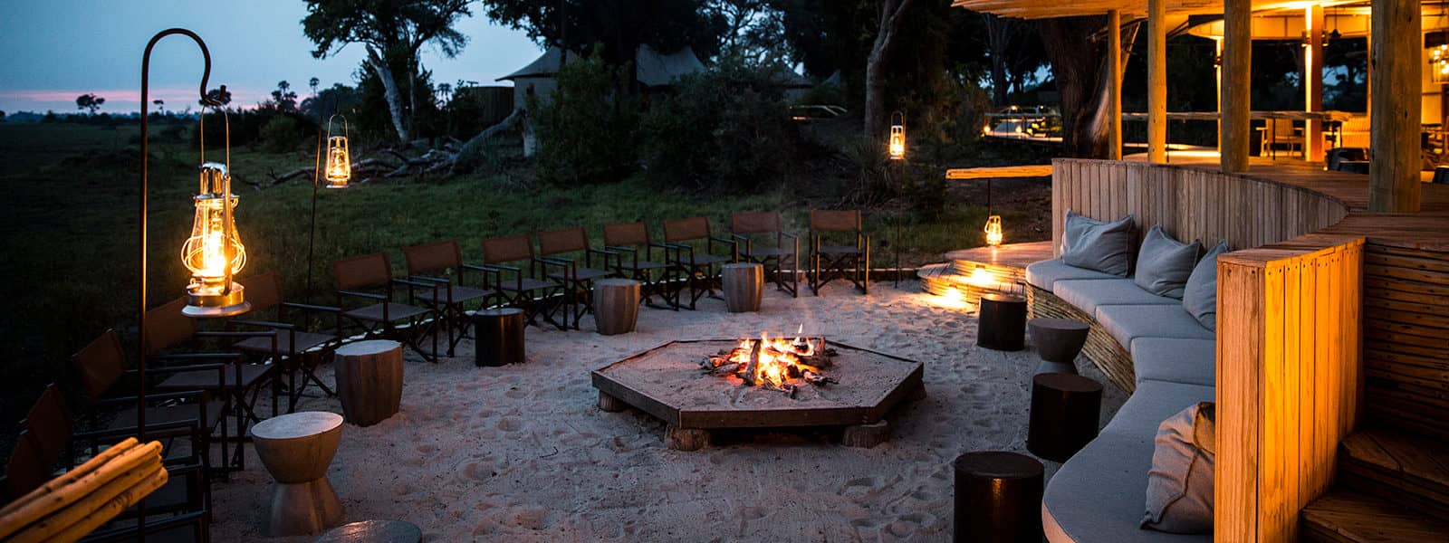 Mombo's central fire pit hosts guests for sundowners and after dinner drinks