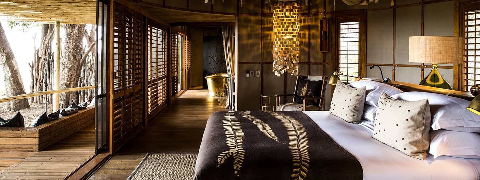 View across the luxurious interleading guest rooms at Mombo Camp