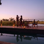 The swimming pool area overlookg the waters and makes a lovely private dinner area