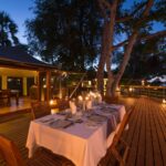 Dinner can be enjoyed on the main wooden deck at Pelo Camp