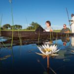 A mokoro excursion along water lily lined channels from Pelo Camp