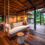 Image of decor and suspended couch in lounge area at Qorokwe