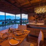 Dining room prepared for dinner at Qorokwe Camp