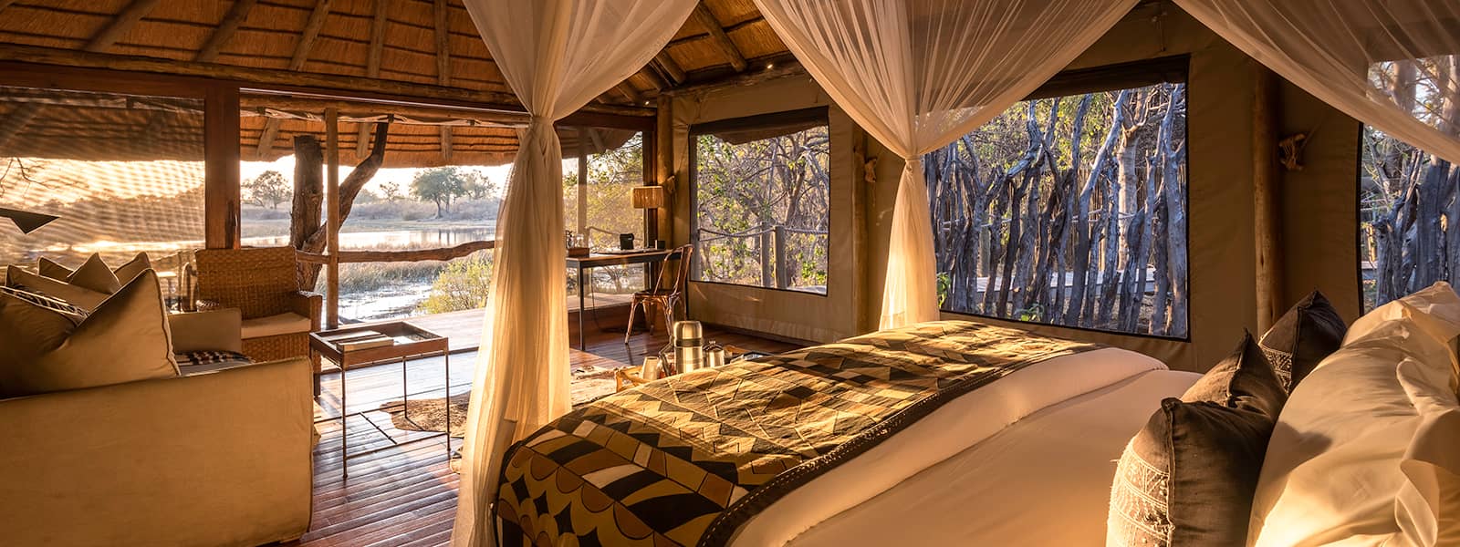 Interior of raised luxury room with outside view at Savuti Camp