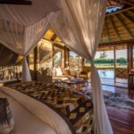 Interior of raised luxury room with outside view at Savuti Camp