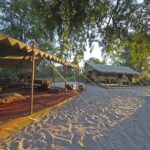 View of the camp and main carpeted lounge area at Selinda Explorers Camp